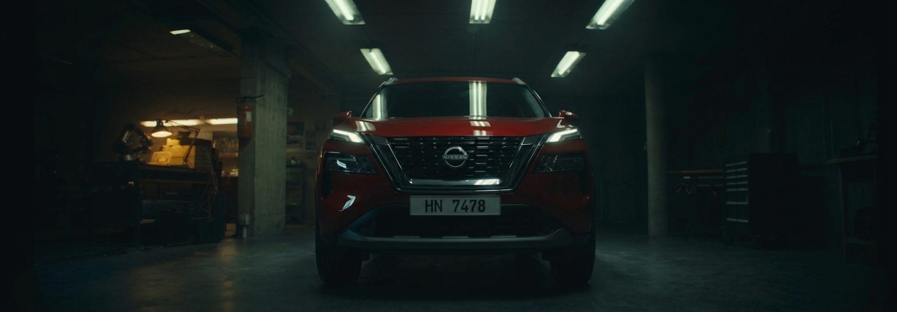 The Nissan Rogue waiting in a dark garage