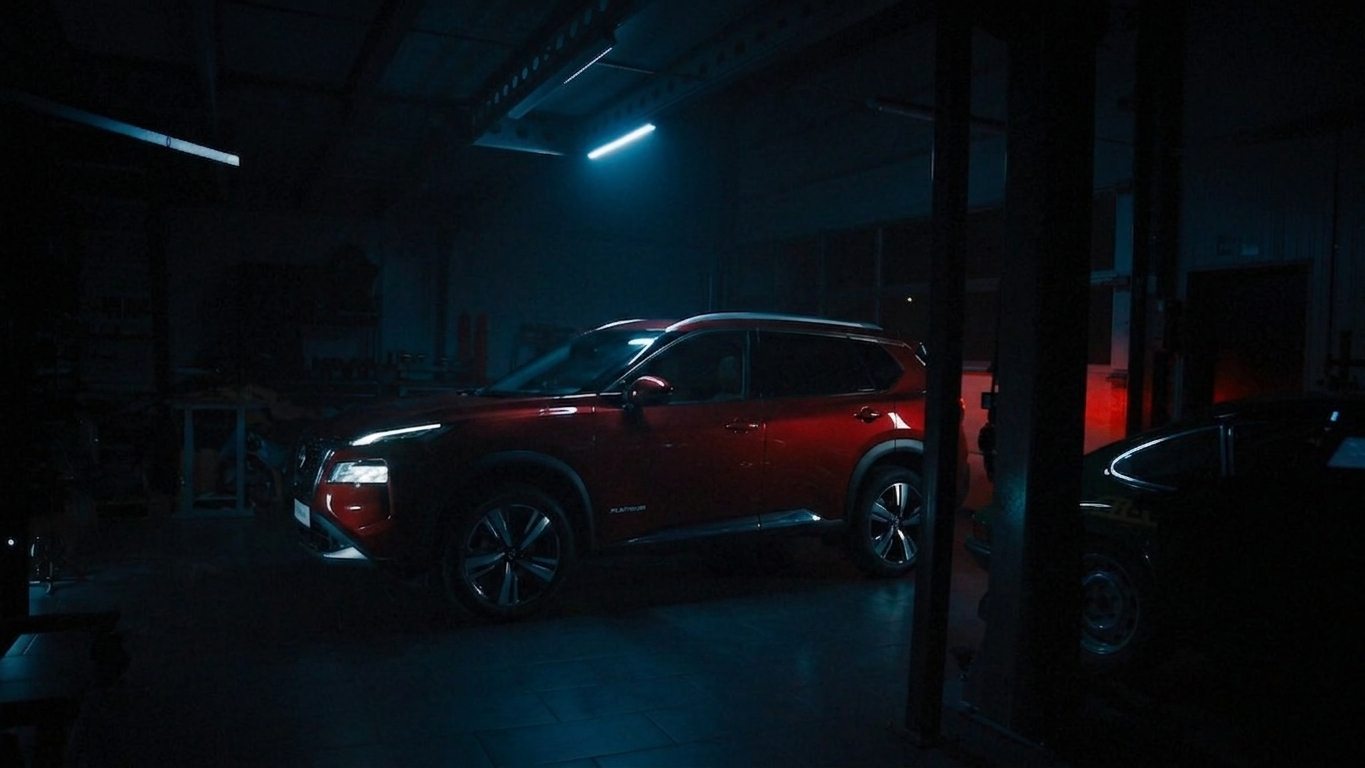 The Rogue in profile in a large garage