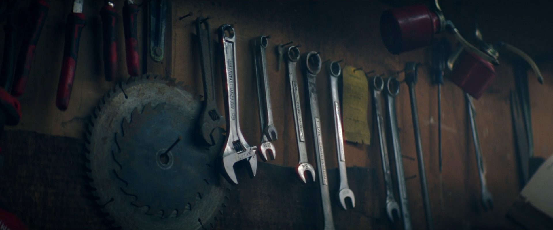 Hand tools hanging on a garage wall