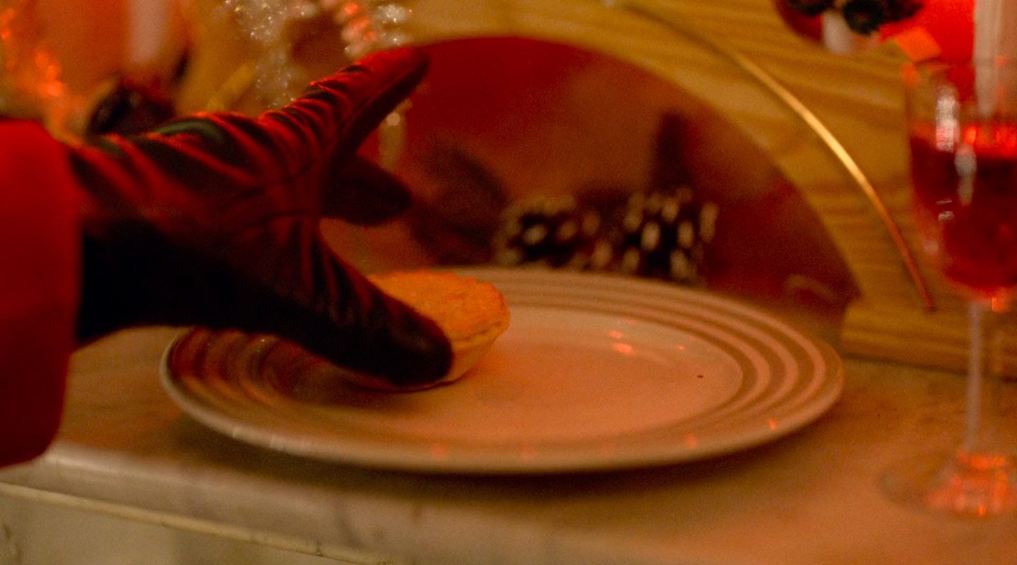 A white glove lifts it